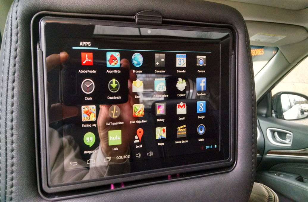 Touch entertainment screen in the headrest of a car