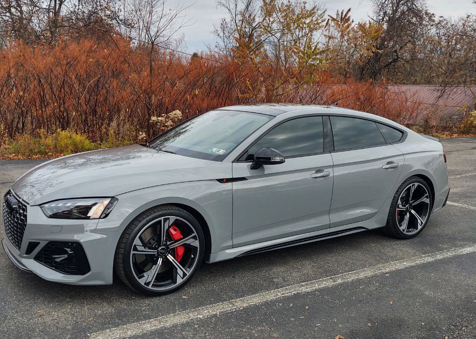 Grey Audi sedan with tinted windows